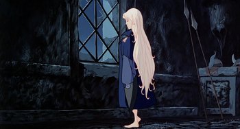 Movie still from “The Last Unicorn” (1982), directed by Jules Bass – A woman with long blonde hair standing in front of a window; Wide shot, Low angle