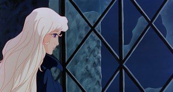 Movie still from “The Last Unicorn” (1982), directed by Jules Bass – A woman standing in front of a window with mountains in the background; Medium shot, Low angle