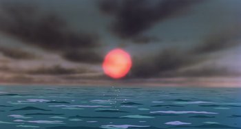 Movie still from “The Last Unicorn” (1982), directed by Jules Bass – The sun is setting over the ocean as seen from the water; Extreme Wide shot, Low angle