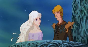 Movie still from “The Last Unicorn” (1982), directed by Jules Bass – A man and a woman are standing next to each other in front of a sky background; Medium shot, Low angle