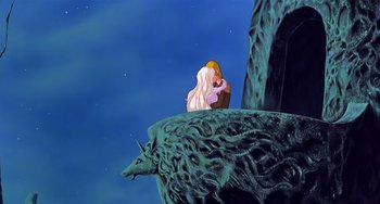 Movie still from “The Last Unicorn” (1982), directed by Jules Bass – A woman sitting on top of a mountain; Wide shot, Low angle