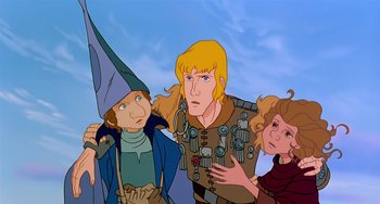 Movie still from “The Last Unicorn” (1982), directed by Jules Bass – A group of people standing next to each other; Medium shot, Low angle