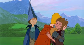 Movie still from “The Last Unicorn” (1982), directed by Jules Bass – A group of people standing next to each other in a field; Medium shot, Over the shoulder angle