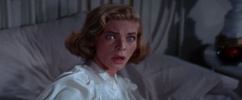 Movie still from “Designing Woman” (1957), directed by Vincente Minnelli – A person with a surprised look on their face; Close Up shot, Low angle