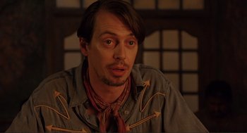 Movie still from “Desperado” (1995), directed by Robert Rodriguez – A person wearing a shirt and tie; Close Up shot, Low angle