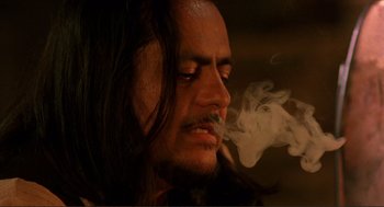 Movie still from “Desperado” (1995), directed by Robert Rodriguez – A person smoking a cigarette; Close Up shot, Low angle