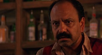 Movie still from “Desperado” (1995), directed by Robert Rodriguez – A person with a beard and mustache; Close Up shot, Low angle