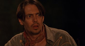 Movie still from “Desperado” (1995), directed by Robert Rodriguez – A person wearing a jacket; Close Up shot, Over the shoulder angle