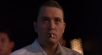 Movie still from “Desperado” (1995), directed by Robert Rodriguez – A person with a cigarette in his mouth; Close Up shot, Low angle