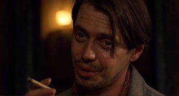 Movie still from “Desperado” (1995), directed by Robert Rodriguez – A person with a cigarette in his mouth; Close Up shot, Over the shoulder angle