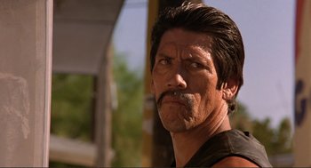 Movie still from “Desperado” (1995), directed by Robert Rodriguez – A person with a mustache; Close Up shot, Low angle