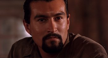 Movie still from “Desperado” (1995), directed by Robert Rodriguez – A person with a beard; Close Up shot, Low angle