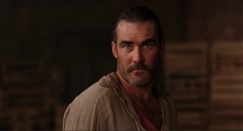 Movie still from “Desperado” (1995), directed by Robert Rodriguez – A person with a beard; Close Up shot, Low angle