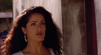 Movie still from “Desperado” (1995), directed by Robert Rodriguez – A beautiful woman with long black curly hair; Close Up shot, Low angle