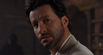 Movie still from “Desperado” (1995), directed by Robert Rodriguez – A person wearing a suit and tie; Close Up shot, Over the shoulder angle