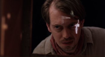 Movie still from “Desperado” (1995), directed by Robert Rodriguez – A person wearing a neck tie; Close Up shot, Low angle