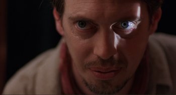 Movie still from “Desperado” (1995), directed by Robert Rodriguez – A person with a blue eye; Extreme Close Up shot, Low angle
