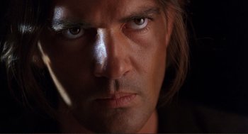 Movie still from “Desperado” (1995), directed by Robert Rodriguez – A man's face in the dark; Close Up shot, Low angle