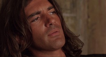 Movie still from “Desperado” (1995), directed by Robert Rodriguez – A person with long hair; Close Up shot, Over the shoulder angle