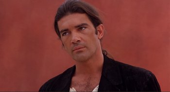 Movie still from “Desperado” (1995), directed by Robert Rodriguez – A person with long hair; Close Up shot, Over the shoulder angle