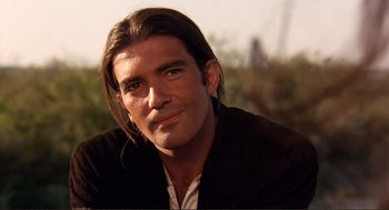 Movie still from “Desperado” (1995), directed by Robert Rodriguez – A person with long hair; Close Up shot, Low angle