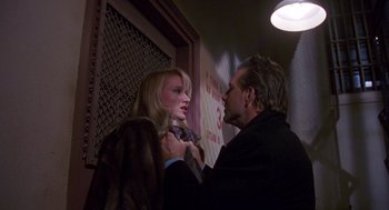 Movie still from “Desperate Hours” (1990), directed by Michael Cimino – A man and a woman are standing in front of each other; Close Up shot, Low angle