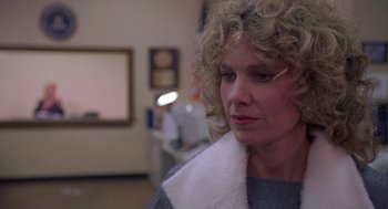 Movie still from “Desperate Hours” (1990), directed by Michael Cimino – A person with curly blonde hair; Close Up shot, Low angle