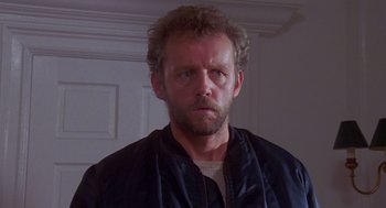 Movie still from “Desperate Hours” (1990), directed by Michael Cimino – A person wearing a jacket; Close Up shot, Low angle