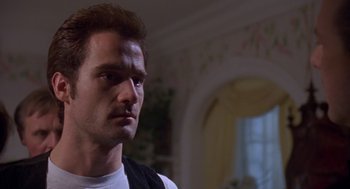 Movie still from “Desperate Hours” (1990), directed by Michael Cimino – A person looking at the camera; Close Up shot, Low angle