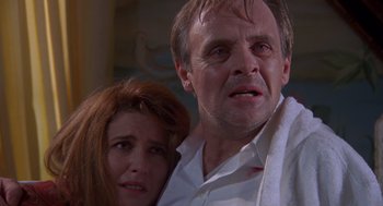 Movie still from “Desperate Hours” (1990), directed by Michael Cimino – A man and a woman are looking at the camera; Close Up shot, Low angle