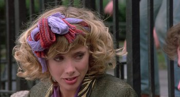 Movie still from “Desperately Seeking Susan” (1985), directed by Susan Seidelman – A person wearing a head scarf; Close Up shot, Over the shoulder angle