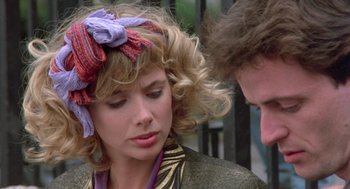 Movie still from “Desperately Seeking Susan” (1985), directed by Susan Seidelman – A man and a woman talking to each other; Close Up shot, Over the shoulder angle