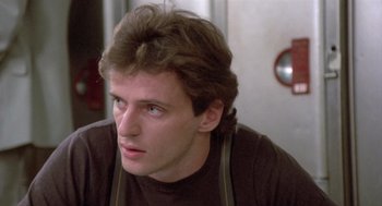 Movie still from “Desperately Seeking Susan” (1985), directed by Susan Seidelman – A person wearing an apron; Close Up shot, Low angle