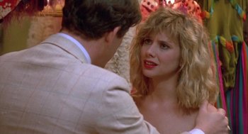 Movie still from “Desperately Seeking Susan” (1985), directed by Susan Seidelman – A man and a woman talking to each other; Close Up shot, Over the shoulder angle