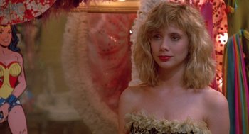 Movie still from “Desperately Seeking Susan” (1985), directed by Susan Seidelman – A person wearing a dress; Close Up shot, Over the shoulder angle