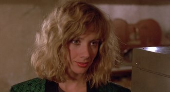 Movie still from “Desperately Seeking Susan” (1985), directed by Susan Seidelman – A person wearing a green jacket; Close Up shot, Over the shoulder angle