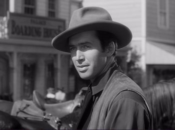 Movie still from “Destry Rides Again” (1939), directed by George Marshall – Black and white photograph of a man wearing a hat; Close Up shot, Low angle