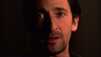 Movie still from “Detachment” (2011), directed by Tony Kaye – A man's face in the dark; Close Up shot, Low angle