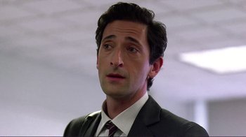 Movie still from “Detachment” (2011), directed by Tony Kaye – A person wearing a suit and tie; Close Up shot, Over the shoulder angle