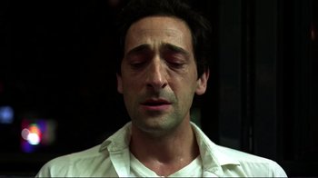 Movie still from “Detachment” (2011), directed by Tony Kaye – A person with his eyes closed; Close Up shot, Low angle