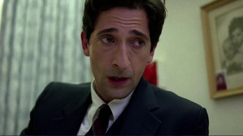 Movie still from “Detachment” (2011), directed by Tony Kaye – A person wearing a suit and tie; Close Up shot, Over the shoulder angle