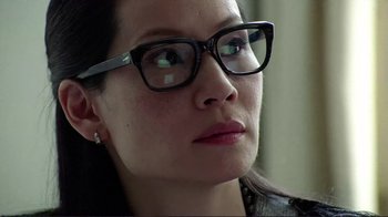 Movie still from “Detachment” (2011), directed by Tony Kaye – A person wearing glasses and looking to the side; Close Up shot, Low angle