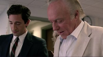 Movie still from “Detachment” (2011), directed by Tony Kaye – A man in a white shirt and a man in a black suit; Close Up shot, Over the shoulder angle