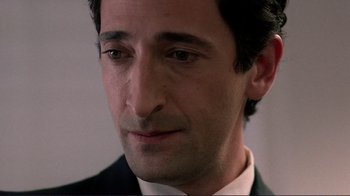 Movie still from “Detachment” (2011), directed by Tony Kaye – A person wearing a suit and tie; Close Up shot, Over the shoulder angle