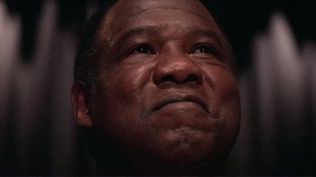 Movie still from “Detachment” (2011), directed by Tony Kaye – A person looking up at the sky; Close Up shot, Low angle