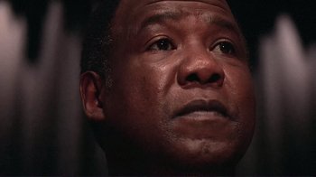 Movie still from “Detachment” (2011), directed by Tony Kaye – A man's face looking upward; Close Up shot, Low angle