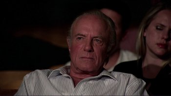 Movie still from “Detachment” (2011), directed by Tony Kaye – An older man is sitting in front of a camera; Close Up shot, Low angle