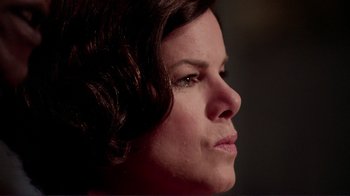 Movie still from “Detachment” (2011), directed by Tony Kaye – A woman's face in a dimly - lit room; Close Up shot, Over the shoulder angle