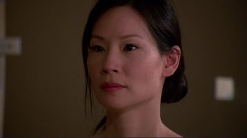 Movie still from “Detachment” (2011), directed by Tony Kaye – A woman's face in a dark room; Close Up shot, High angle