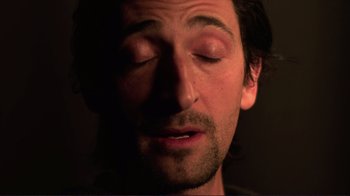 Movie still from “Detachment” (2011), directed by Tony Kaye – A person with his eyes closed; Extreme Close Up shot, Low angle